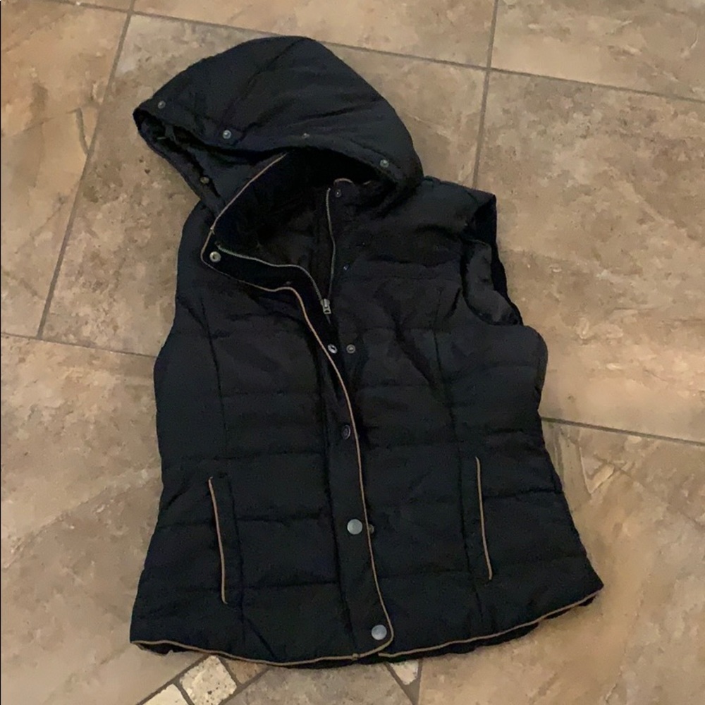 Black vest with brown trim